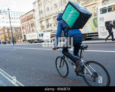 A Deliveroo cyclist on Piccadilly in London Stock Photo