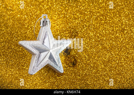 golden sparkles with silver star, christmas card Stock Photo