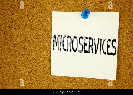 Conceptual hand writing text caption inspiration showing Microservices. Business concept for  Micro Services written on sticky note, reminder cork bac Stock Photo
