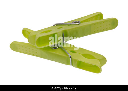 Green plastic pegs isolated on a white background Stock Photo