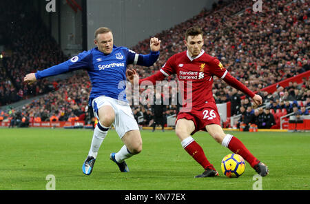Everton's Wayne Rooney (left) and Liverpool's Andrew Robertson battle for the ball during the Premier League match at Anfield, Liverpool. Stock Photo