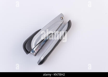 Close-Up Of Stapler On Table,against white background. Stock Photo