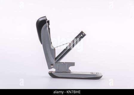 Close-Up Of Stapler On Table,against white background. Stock Photo