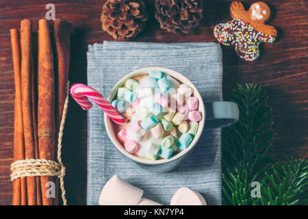 Marshmallows and Candy Cane in Cup of Hot Chocolate Stock Photo