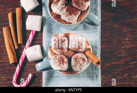 Cups of Hot Chocolate with Marshmallows and Cocoa Powder Stock Photo