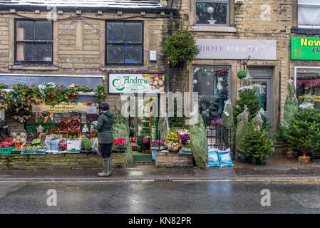 Holmfirth, UK. 10th Dec, 2017. Lonley shopper as snow hits the peak district town of Holmfirth, West Yorkshire, England. 10th December 2017. Carl Dickinson/Alamy Live News. Credit: CARL DICKINSON/Alamy Live News Stock Photo