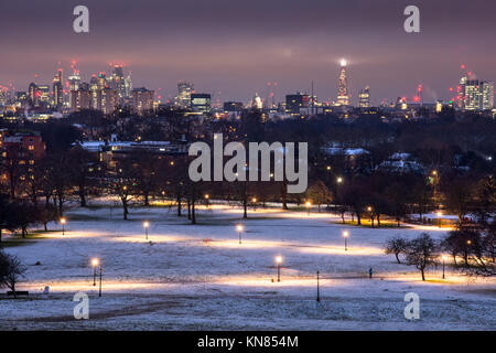 UK weather - London, England, UK - December 10, 2017: Snow lies on Regent's Park, with the skyline of the City of London and Westminster behind, viewed from Primrose Hill. Credit: Joe Dunckley/Alamy Live News