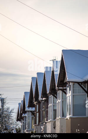 Leominster, UK. 11th December, 2017. Snow capped rooftops on terraced houses are seen on South Street inLeominster on December 11th 2017. Credit: Jim Wood/Alamy Live News Stock Photo