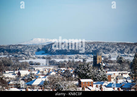 Leominster, UK. 11th December, 2017. Looking towards Clee Hill from Leominster with the leominster Priory Church in the foreground on December 11th 2017. Credit: Jim Wood/Alamy Live News Stock Photo