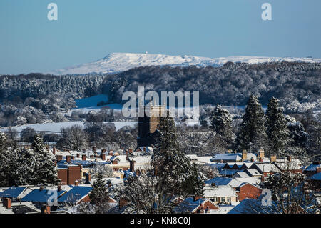 Leominster, UK. 11th December, 2017. Looking towards Clee Hill from Leominster with the Leominster Priory Church in the foreground on December 11th 2017. Credit: Jim Wood/Alamy Live News Stock Photo
