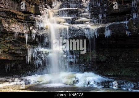 Bowlees, Teesdale, County Durham UK. Monday 11th December 2017. UK Weather.  With overnight temperatures dropping to -10 deg C in some areas, Summerhill Force Waterfall near Bowlees began to freeze up creating spectacular icicles and columns.  Credit: David Forster/Alamy Live News Stock Photo