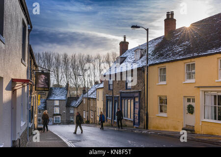 Malmesbury, UK. 11th Dec, 2017. UK Weather - After the previous days heavy snowfall, a brief spell of sunshine lights up the Wiltshire hillside town of Malmesbury. Credit: Terry Mathews/Alamy Live News Stock Photo