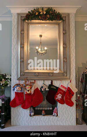 Christmas stockings hanging on a fireplace, East Molesey, Surrey, England, Great Britain, United Kingdom, UK, Europe Stock Photo