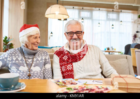 Happy Senior Couple Celebrating Christmas Stock Photo