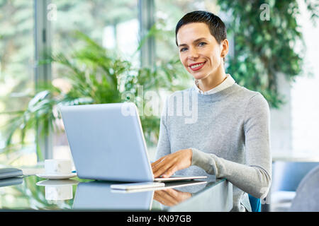 Successful Businesswoman Working in Office Stock Photo
