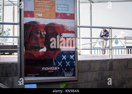 Image of Kevin Spacey promoting House of Cards on advertizing hoarding on telephone kiosk in Spain. Stock Photo