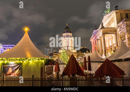 View over the Christmas Market 'Weihnachtszauber Gendarmenmarkt' with the New Church (Deutscher Dom) & Konzerthaus in the background, Berlin, Germany Stock Photo