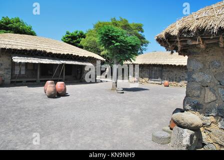 Traditional, Aboriginal village huts with thatched roofs. Depicting culture, heritage, poverty and lifestyle. Stock Photo