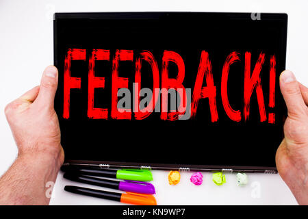 Feedback text written on tablet, computer in the office with marker, pen, stationery. Business concept for Opinion Information Positive Negative Feedb Stock Photo