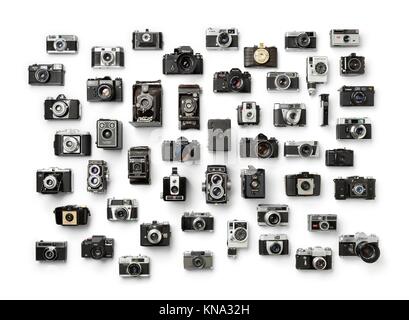 Collection of old analog different camera's on white background.