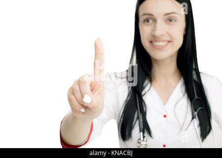 Young attractive woman doctor touching invisible button isolated on white background. Stock Photo