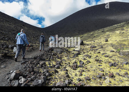 Tourists on excursions in places of Hiking trail climb to the North Breakthrough Great Tolbachik Fissure Eruption 1975 Stock Photo