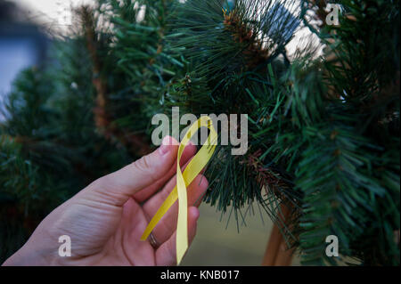 Air Commandos and family attended a Christmas tree lighting ceremony at Hurlburt Field, Fla., Dec. 1, 2017. Along with visiting Santa Claus and enjoying free food and games, family members continued a tradition of pinning yellow ribbons on a wreath to remember those deployed during this holiday season. (U.S. Air Force Stock Photo