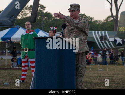 Air Commandos and family attended a Christmas tree lighting ceremony at Hurlburt Field, Fla., Dec. 1, 2017. Along with visiting Santa Claus and enjoying free food and games, family members continued a tradition of pinning yellow ribbons on a wreath to remember those deployed during this holiday season. (U.S. Air Force Stock Photo