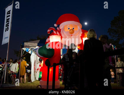 Air Commandos and family attended a Christmas tree lighting ceremony at Hurlburt Field, Fla., Dec. 1, 2017. Along with visiting Santa Claus and enjoying free food and games, family members continued a tradition of pinning yellow ribbons on a wreath to remember those deployed during this holiday season. (U.S. Air Force Stock Photo