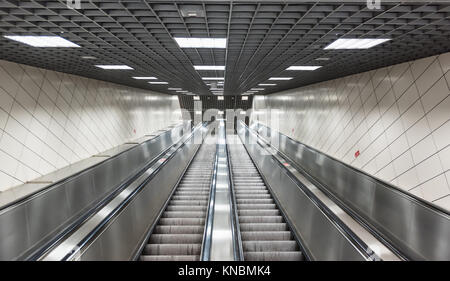 Moving stairs in underground.Escalator stairs in metro station. Stock Photo