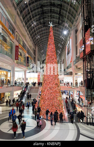 Christmas scene, Toronto Eaton Centre Christmas tree decoration, people inside the shopping mall, downtown Toronto, Canada. Stock Photo