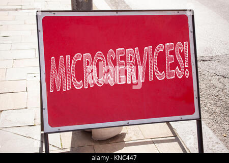 Conceptual hand writing text caption inspiration showing Microservices. Business concept for Micro Services written on announcement road sign with bac Stock Photo
