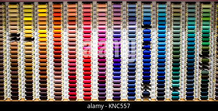 Badajoz, Spain - August 30th, 2017: sewing thread reels on a market stall. Typical background on a notions store Stock Photo