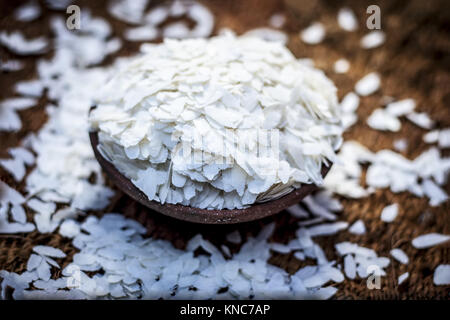 Oryza sativa,Puffed rice in a clay bowl on a gunny background. Stock Photo