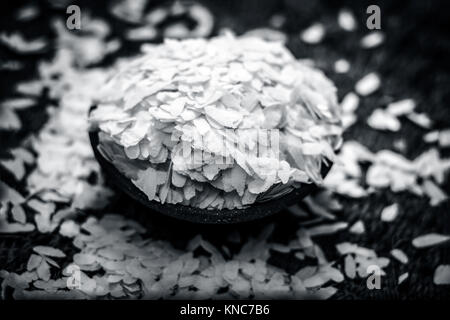 Oryza sativa,Puffed rice in a clay bowl on a gunny background. Stock Photo