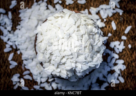 Oryza sativa,Puffed rice in a clay bowl on a gunny background. Stock Photo