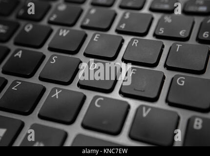 Close up of a black laptop keyboard and its keys Stock Photo