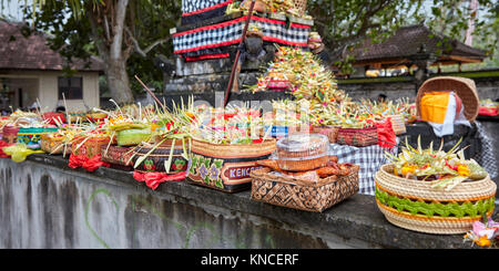 Open-air altar with various food offerings at local temple. Sengkidu village near Candidasa, Karangasem Regency, Bali, Indonesia. Stock Photo