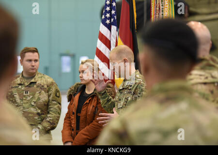 ANSBACH, Germany – Col. Kenneth Cole, 12th Combat Aviation Brigade (CAB) Commander gives a speech in front of the Headquarters and Headquarters Company (HHC), 12th CAB Soldiers and Cpt. William McGinnis’ wife Simone McGinnis as he is going to present an award to outgoing HHC Commander Cpt. William McGinnis. Katterbach Army Airfield, Dec. 6, 2017 (U.S. Army Stock Photo