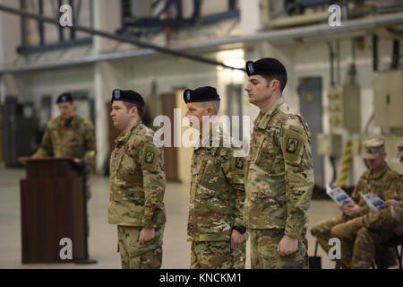 ANSBACH, Germany – Col. Kenneth Cole, 12th Combat Aviation Brigade (CAB) Commander presided over the Headquarters and Headquarters Company, 12th CAB Change of Command ceremony Wednesday, 12 December, 2017, on Katterbach Army Airfield. During the ceremony Cpt. William McGinnis relinquished command to Cpt. Charles Flanagan. (U.S. Army Stock Photo