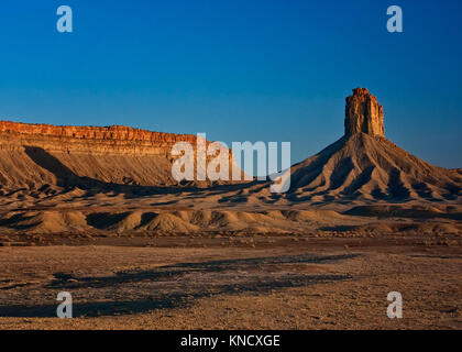 Chimney Rock in the Four Corners Region of the United States of America Casts a Long Shadow onto a Nearby Mesa at Sunset Stock Photo