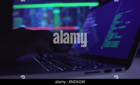 Computer programmer in glasses working on a computer Stock Photo