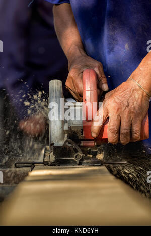 Close-up of carpenter's hands working with wood Stock Photo