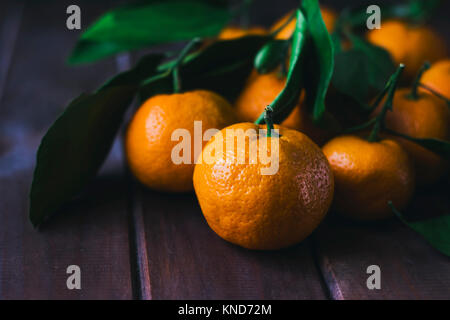 Fresh tangerines on wooden background. Close up Stock Photo