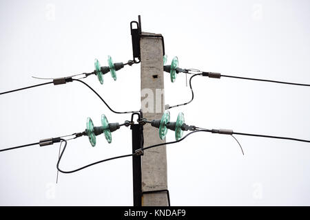 Glass Insulators on power lines Stock Photo