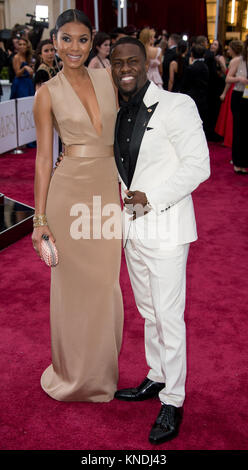 HOLLYWOOD, CA - FEBRUARY 22:  Kevin Hart and Eniko Parrish attendst the 87th Annual Academy Awards at Hollywood & Highland Center on February 22, 2015 in Hollywood, California.   People:  Kevin Hart and Eniko Parrish Stock Photo