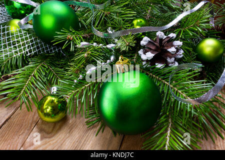 Christmas green ornament and silver ribbon wreath on the rustic wooden background, copy space. Stock Photo