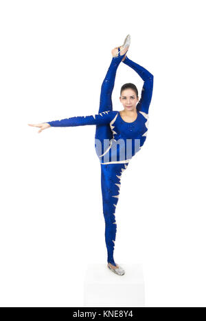 Acrobat does gymnastics, isolated image on a white background. A young circus artist in a blue suit , performs acrobatic elements. Stock Photo