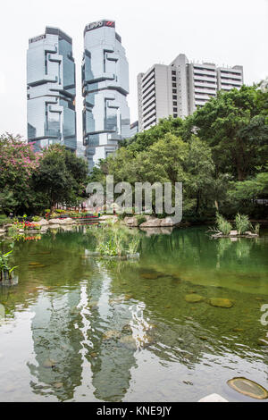 The lake in Hong Kong park with the skyscrapers on the background. Stock Photo