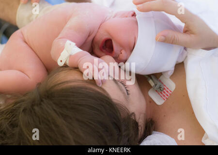 Mother with her newborn baby girl Stock Photo